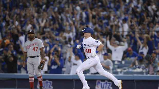 Oct 3, 2019; Los Angeles, CA, USA; Los Angeles Dodgers shortstop Gavin Lux (48) rounds the bases off a solo home run as Washington Nationals first baseman Howie Kendrick (47) looks on during the eighth inning in game one of the 2019 NLDS playoff baseball series at Dodger Stadium. Mandatory Credit: Gary A. Vasquez-USA TODAY Sports